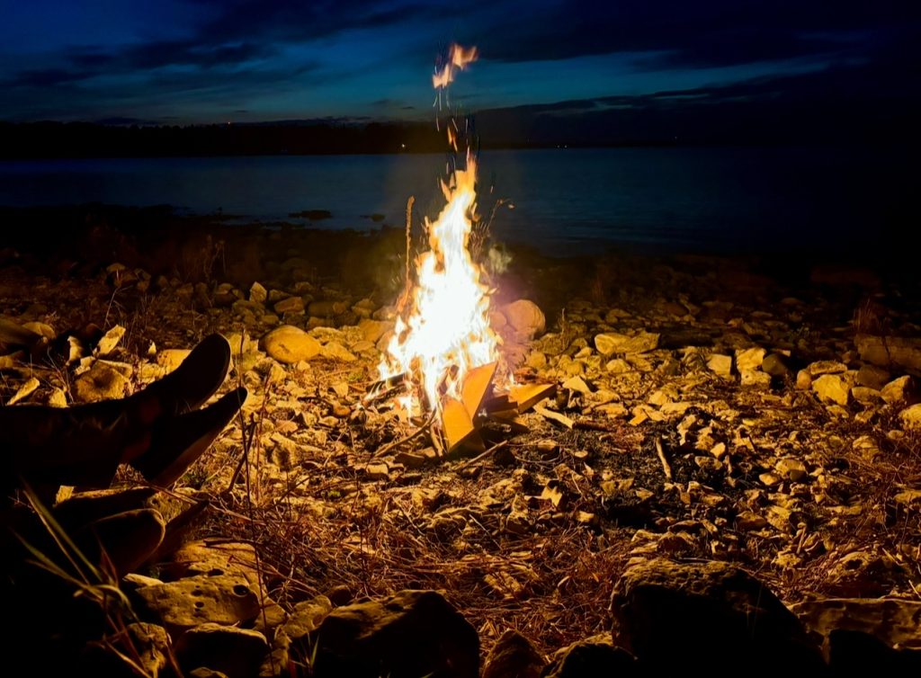 Beach bonfire during a glamping getaway at Butter & Grahams on Drummond Island.