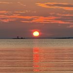 Sunset light glowing across Lake Huron in Northern Michigan